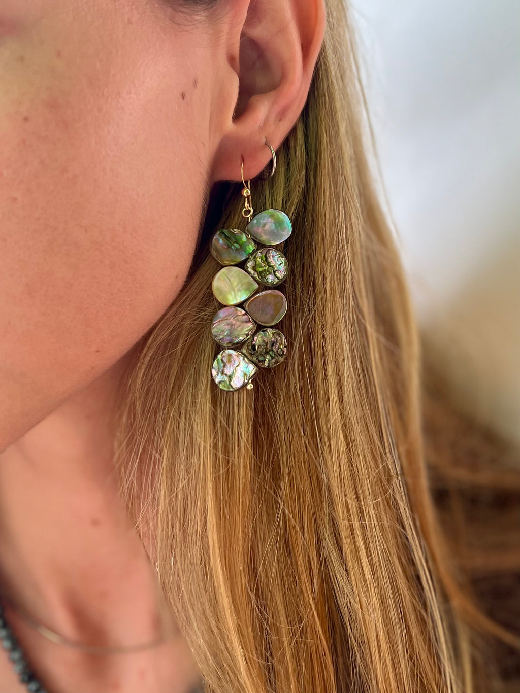 Stacked abalone earrings which flutter with movement as you wear them.  Materials Matter: farm raised abalone beads on gold fill ear wires.  Made by Badass Women for Badass People: Designed in California by Carrie Marill and made by hand in her SoCal studio.