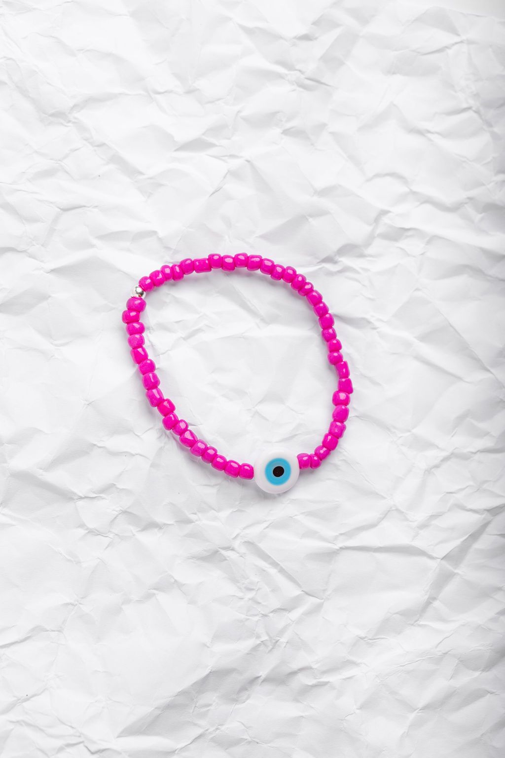 Neon pink Japanese glass beads on sturdy elastic. For that little pop of color and protection for your personal space bubble. Wear just one or stack 'em.
