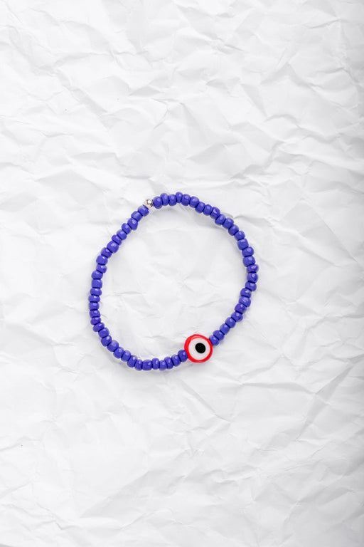 Blue Japanese glass beads on sturdy elastic. For that little pop of color and protection for your personal space bubble. Wear just one or stack 'em.