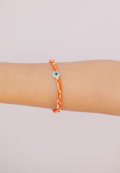Striped orange & white Japanese glass beads on sturdy elastic. For that little pop of color and protection for your personal space bubble. Wear just one or stack 'em.