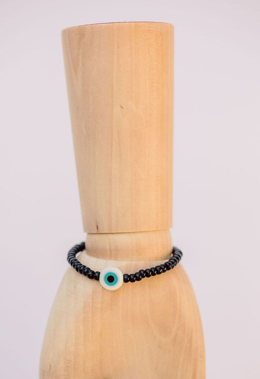 Black Japanese glass beads on sturdy elastic. For that little pop of color and protection for your personal space bubble. Wear just one or stack 'em.