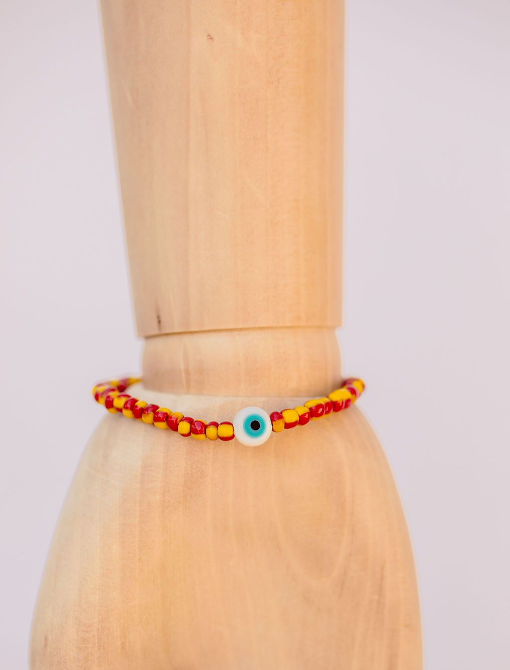 Red & yellow Japanese glass beads on sturdy elastic. For that little pop of color and protection for your personal space bubble. Wear just one or stack 'em.