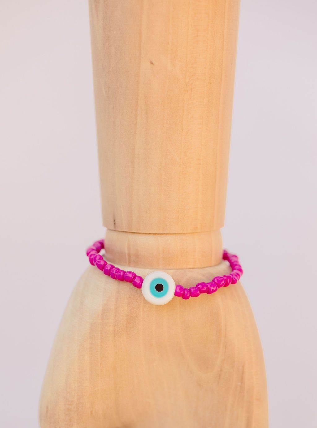 Neon pink Japanese glass beads on sturdy elastic. For that little pop of color and protection for your personal space bubble. Wear just one or stack 'em.