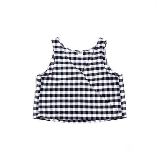 A versatile reversible swing tank in red and white gingham or black and white gingham. Sustainably made in the USA from deadstock cotton. Easy care.