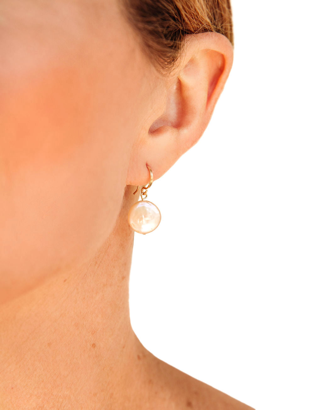 Small Pearl Coin Earrings with 14k gold details.  These half-inch minimalist beauties are the most symmetrical of the pearls I offer, they are a warm white almost pink in color.