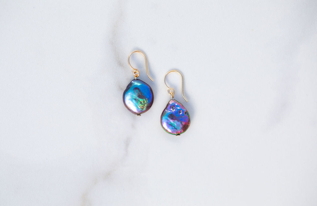 Small Peacock Pearl Coin Earrings with 14k gold details.  These iridescent beauties are beautiful pools of dark rainbows.