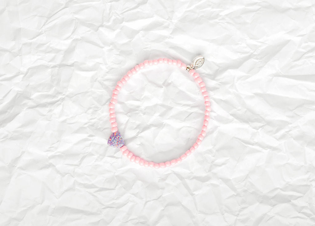7" soft pink glass beaded bracelet with purple opal unicorn heart 💜   Available in small (7") or large (7.5") sizes.