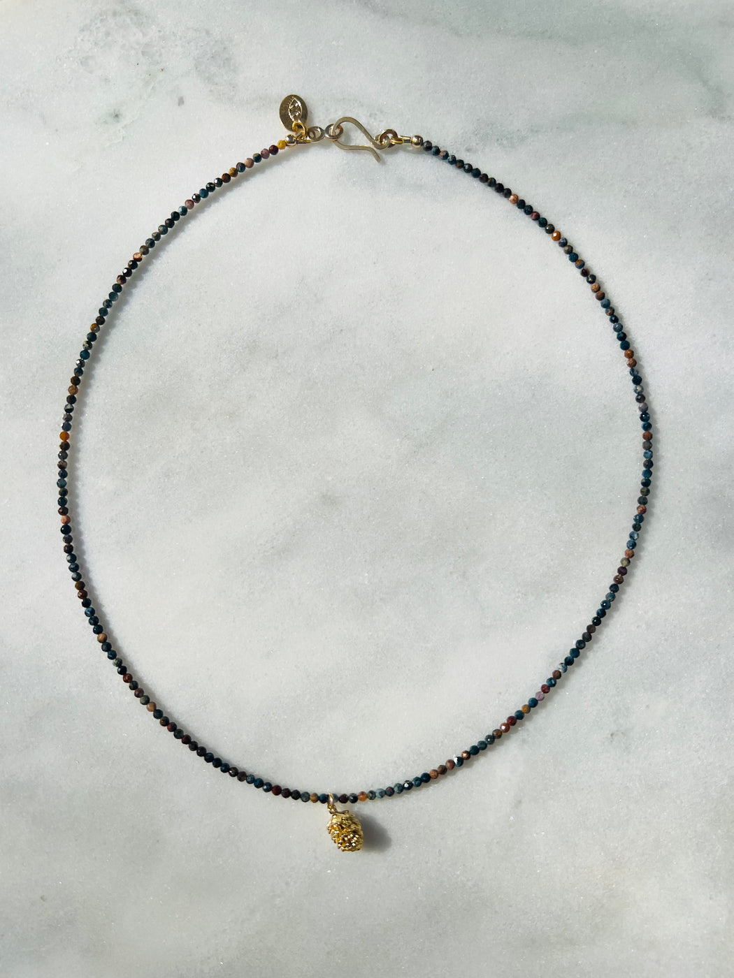 Nature's genius is already within you. Receive her downloads for your creative prowess with a hand from inspiring and vitality-boosting pietersite and enlightening pine. -- Pietersite strung on coated gold wire, Gold Vermeil clasp, pinecone charm.Available at PUNK WASP.