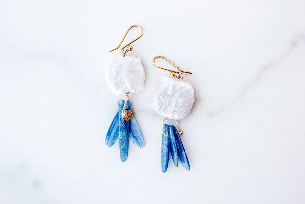 Large freshwater pearls with dangling pieces of Kyanite, accented by 14k gold details.