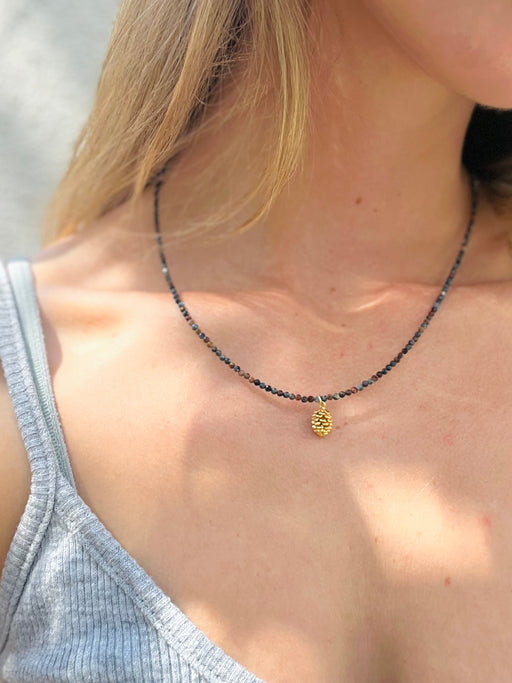  Nature's genius is already within you. Receive her downloads for your creative prowess with a hand from inspiring and vitality-boosting pietersite and enlightening pine. -- Pietersite strung on coated gold wire, Gold Vermeil clasp, pinecone charm.