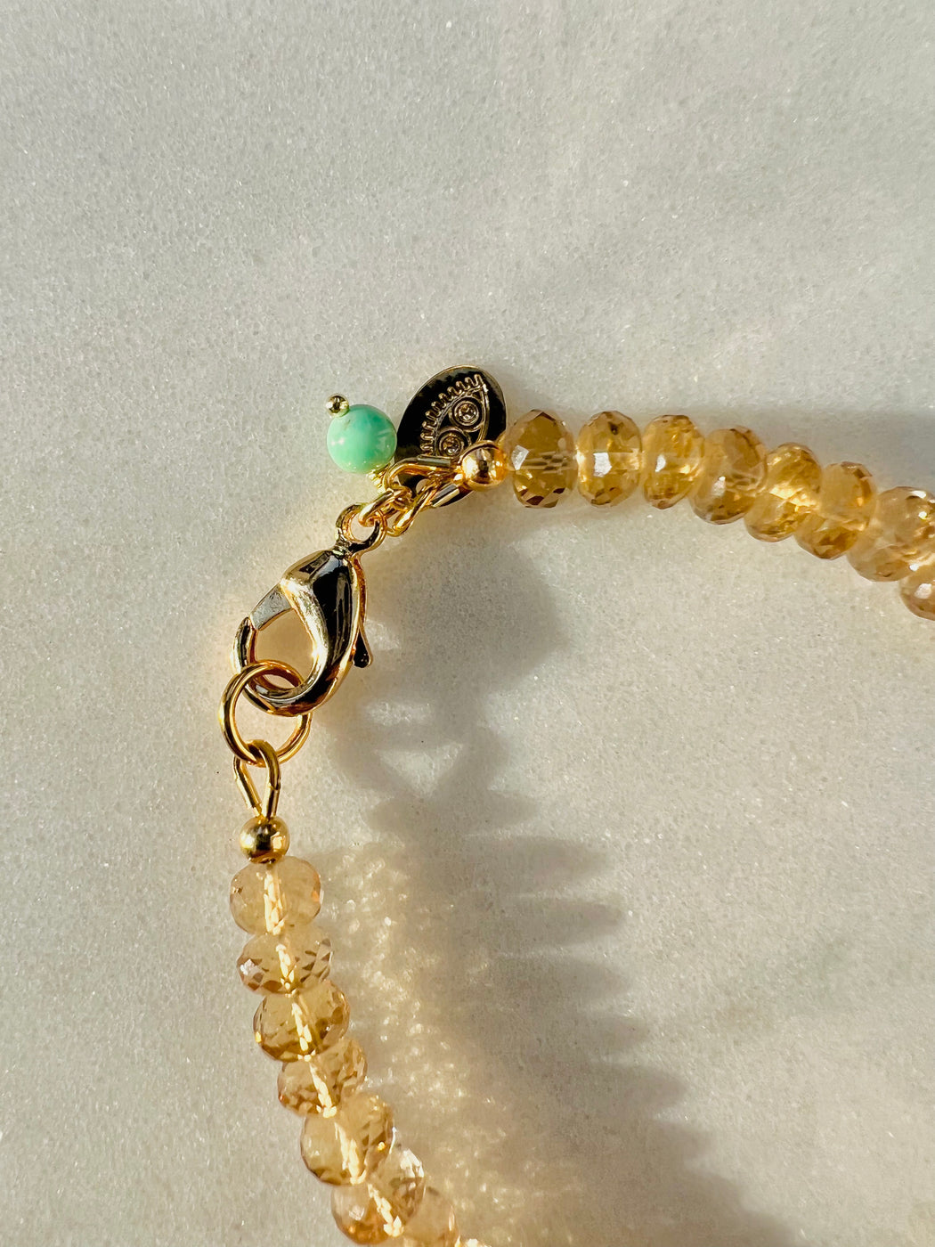 Faceted Champagne Quartz 7” Bracelet - Gold Fill clasp strung on coated gold wire.   Accented with Chrysoprase