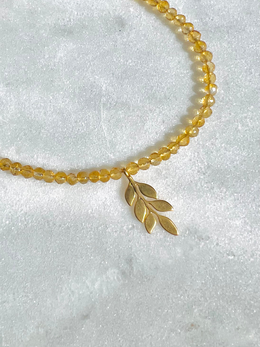 Citrine Necklace - strung on gold coated wire with gold fill clasp. Accented with Leaf charm. PUNKWASP by Carrie marill