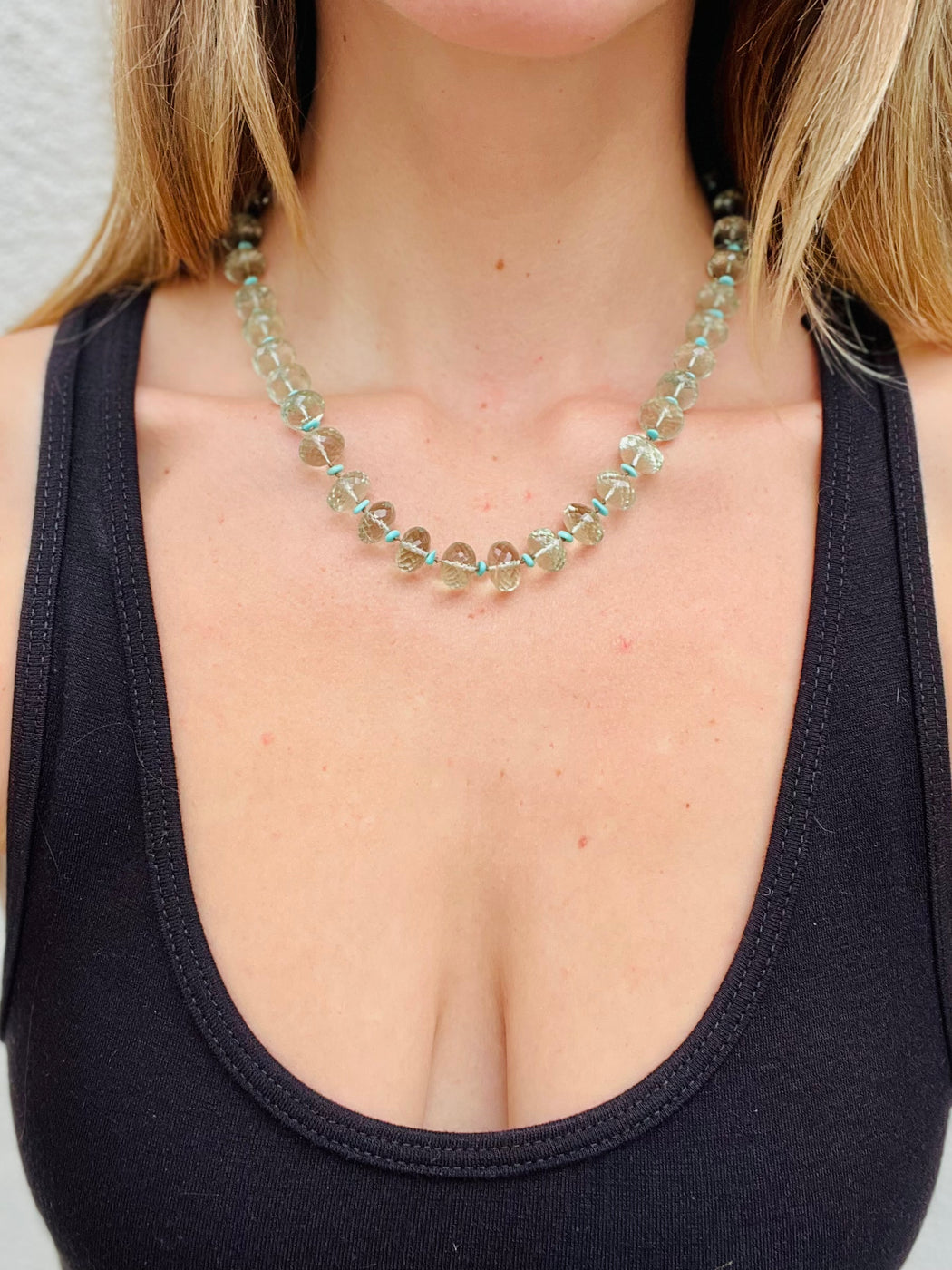 Faceted Green Amethyst spaced with turquoise on hand knotted silk chord with gold fill clasp. 19"