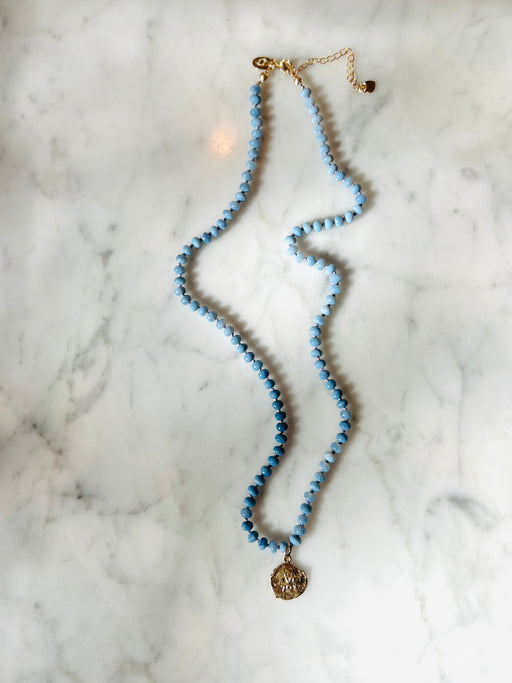 Open the floodgates & flow with your creative downloads. Blue Peruvian Opals creates serenity within the mind to hear that inner voice.   Hand knotted on silk chord with Roman Gold coin. necklace designed by Carrie Marill 