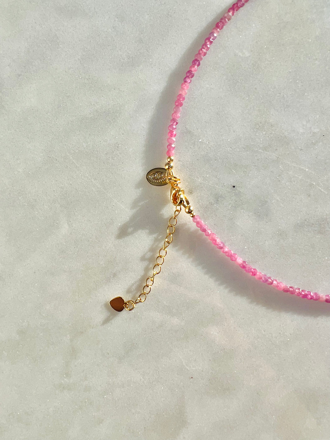 Illuminate the abundance that lives within you - Pink Sapphires remind us of the unlimited love & joy in the universe available to us.   Materials matter: Pink Sapphire's strung on coated gold wire with Gold Fill clasp & star charm. PUNKWASP by Carrie Marill.