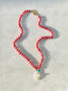 Thulite on hand knotted silk chord, with freshwater pearl & Turquoise, gold fill clasp. 19"