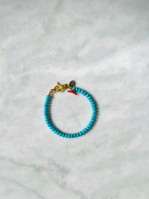 Smooth turquoise 7” Bracelet - Strung on coated gold wire with detailed Gold Vermeil clasp from Turkey.  Accented with Coral. PUNKWASP by Carrie Marill