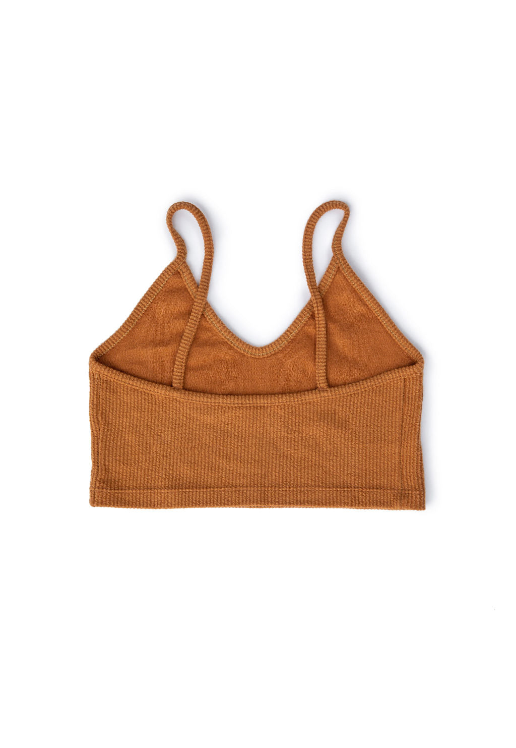Be one with the sun. This glowing sienna crop top is made with soft, ribbed cotton for your comfort. Spaghetti straps and a not-too-tight fit make it feel like you’re wearing nothing — perfect for hot days (and nights) when clothes feel like a burden. Pair it with the Under the Tucson Sun Flowy Short and let your natural glow shine through. 